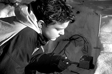 A McGrath student using the density sampling box