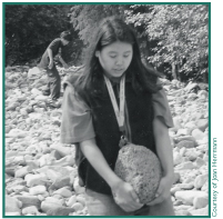 Christine Bernsten gathers steambath rocks near Nabesna.