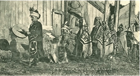 Men in ceremonial regalia in front of Klukwan clan house, c. 1880s