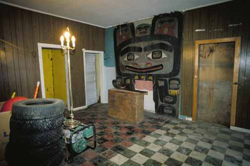 The Bear House in Klukwan shelters a carved screen, spoon and box drum as well as tires and generators.