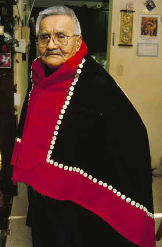 George Stevens, 77, of Klukwan wears his button blanket.