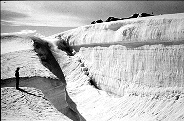 An exposed wall with a person standing nearby