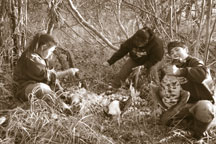 Pauline shows Solomon and Oxenia how to pluck geese
